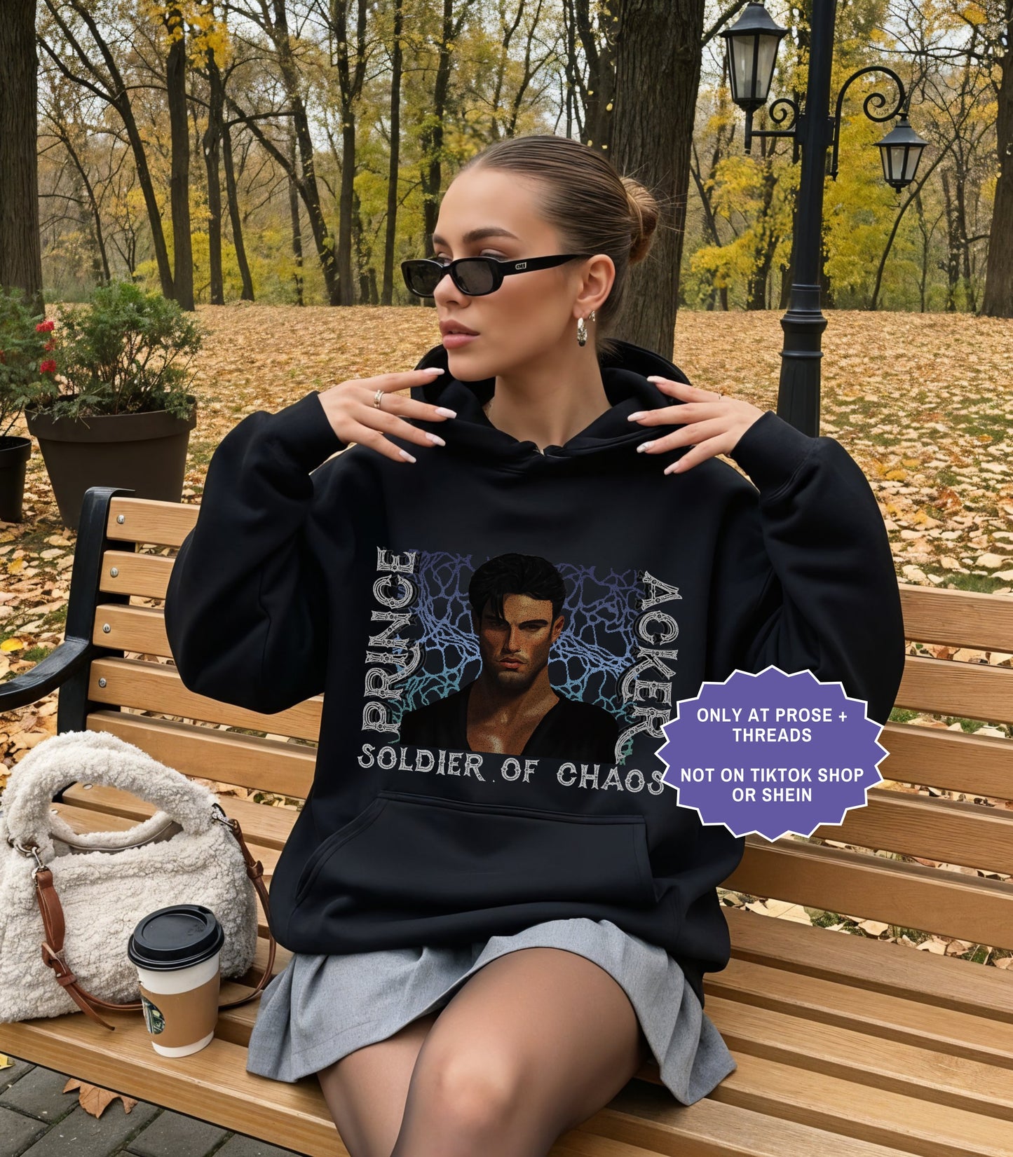 Woman wearing oversized Acker Soldier of Chaos hoodie inspired by Metal Slinger fantasy romance series