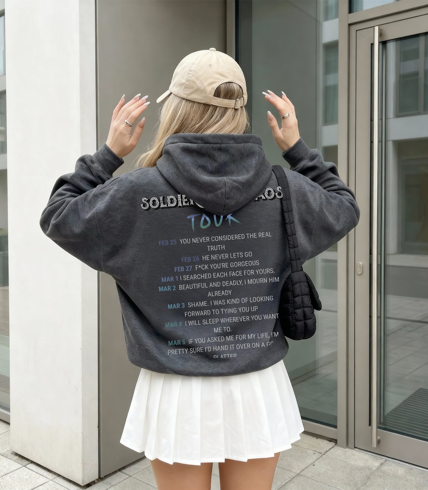 Woman wearing oversized Acker Soldier of Chaos hoodie inspired by Metal Slinger fantasy romance series