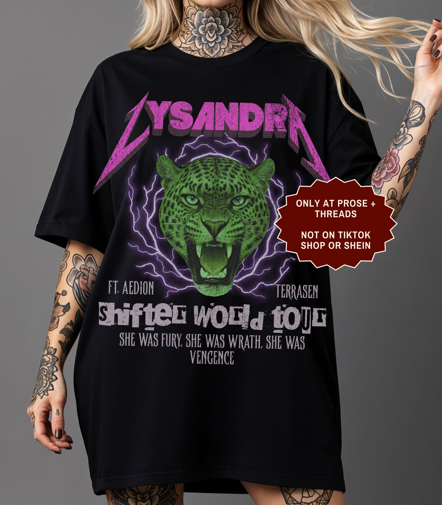 Lysandra Ennar Throne of Glass graphic t-shirt featuring a fierce green feline fantasy design on charcoal gray apparel