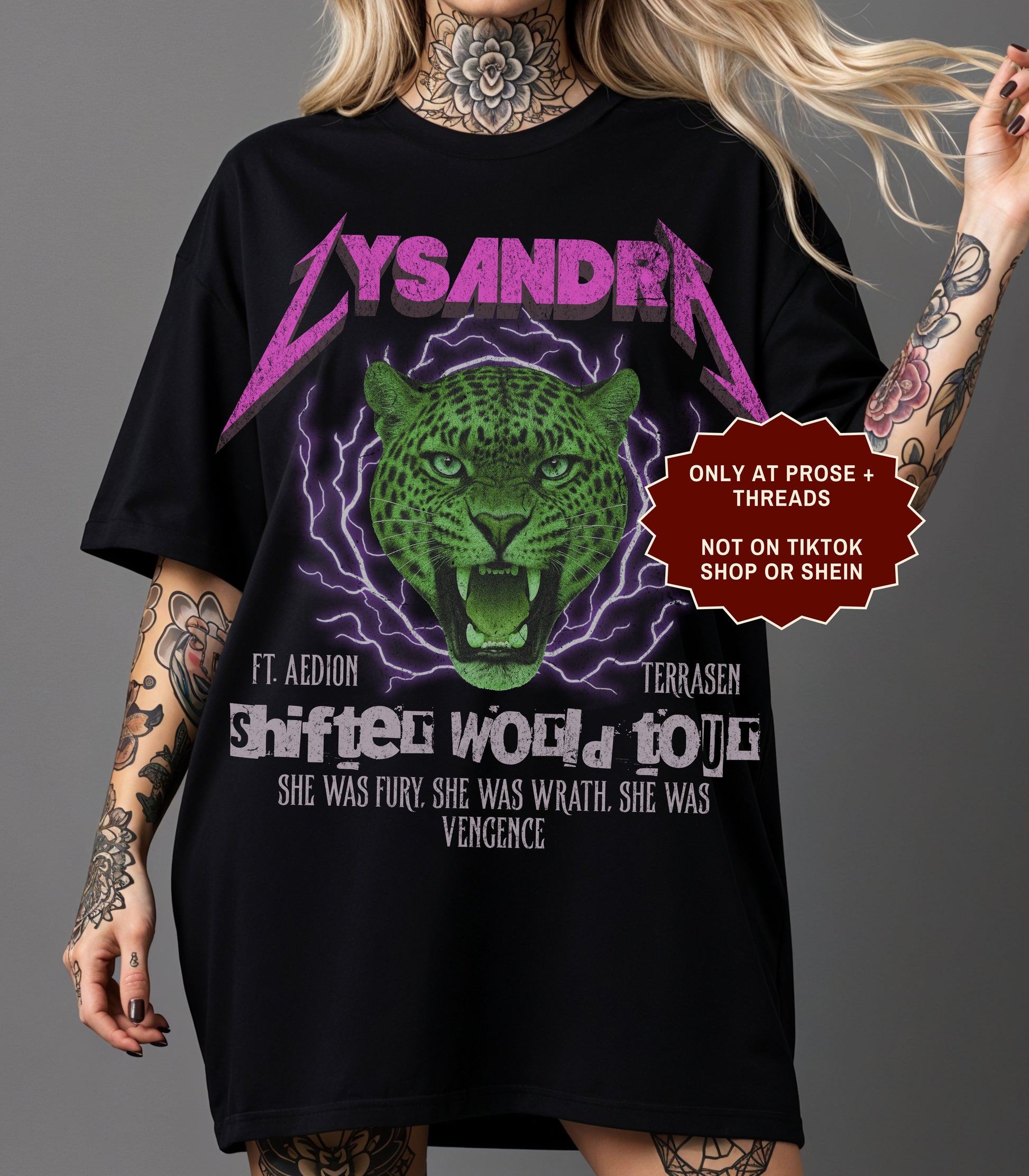 Lysandra Ennar Throne of Glass graphic t-shirt featuring a fierce green feline fantasy design on charcoal gray apparel