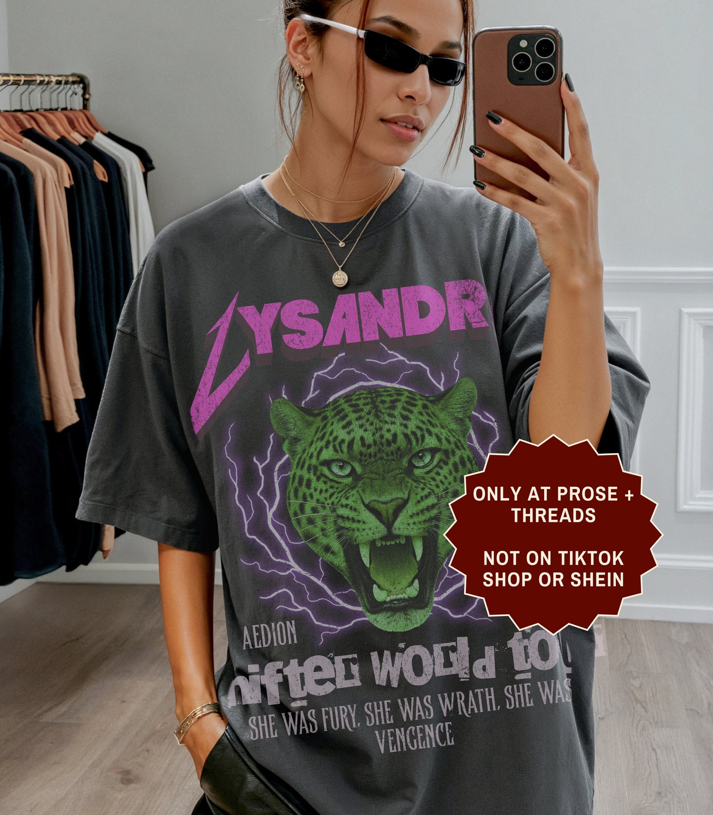 Lysandra Ennar Throne of Glass graphic t-shirt featuring a fierce green feline fantasy design on charcoal gray apparel