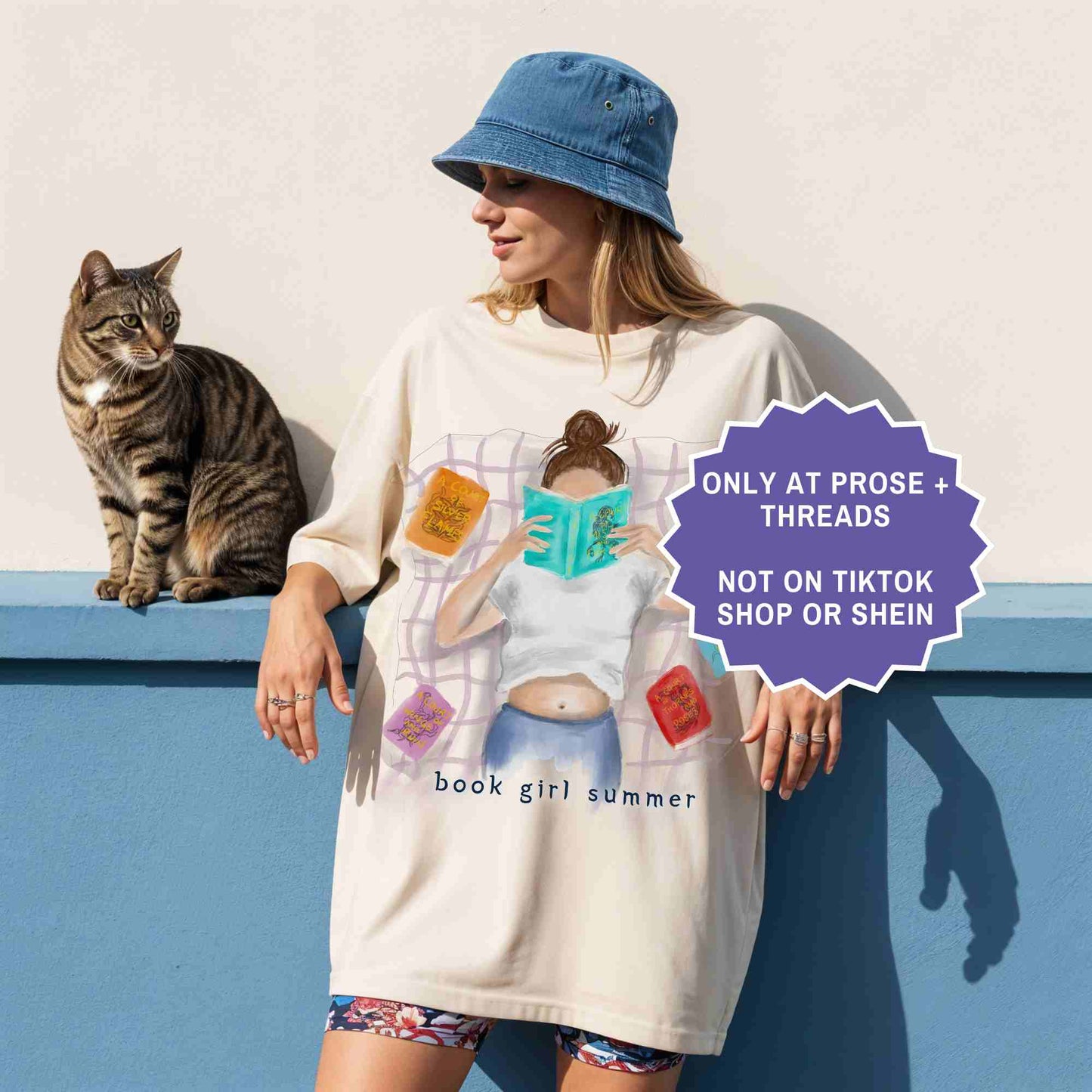 watercolor ivory shirt featuring a girl reading on a blanket, surrounded by ACOTAR books