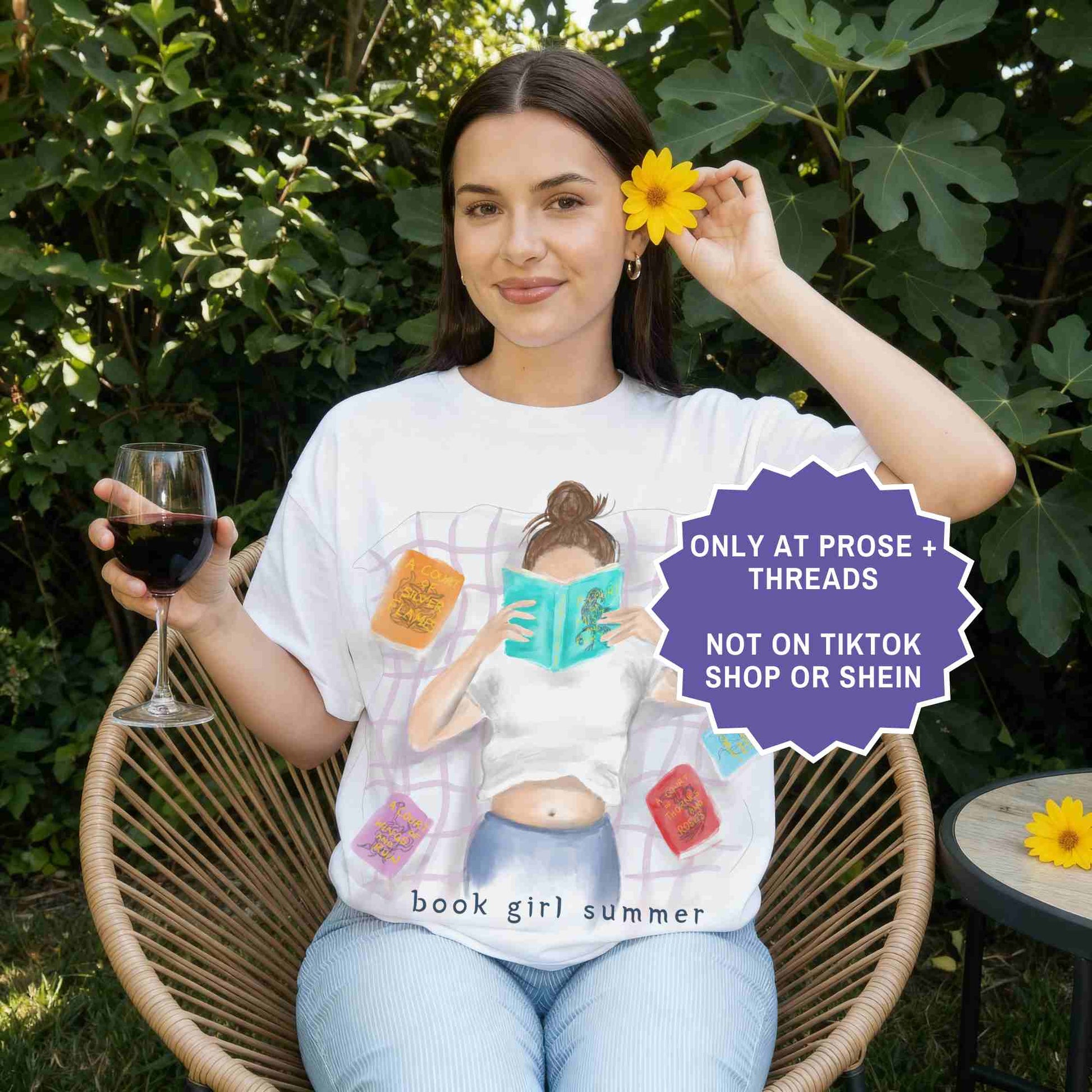 watercolor white shirt featuring a girl reading on a blanket, surrounded by ACOTAR books