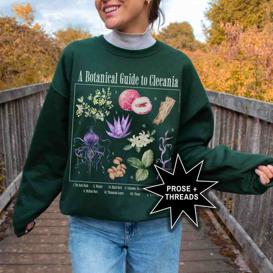 Woman wearing Clecanian Botanical Sweatshirt with celestial botanical graphic