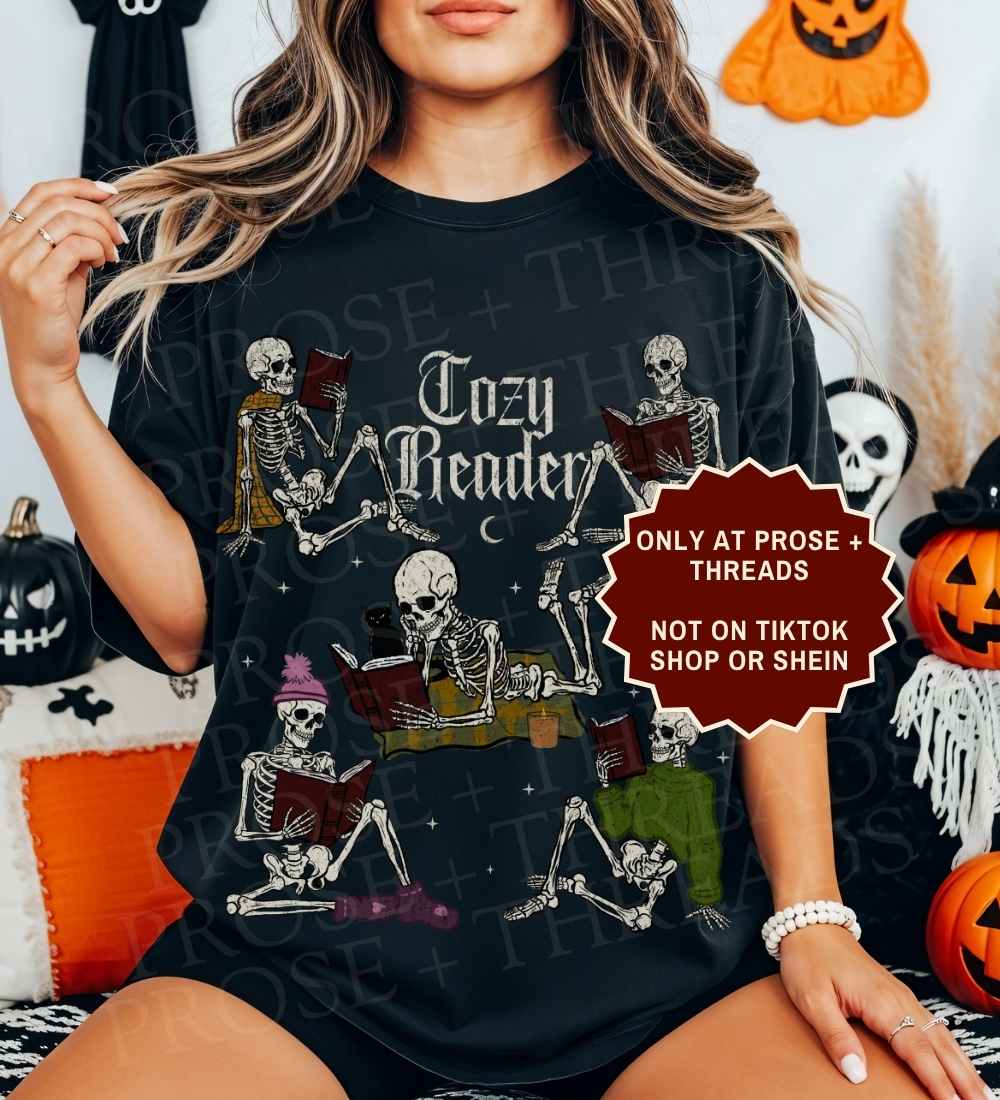 Cozy Reader Shirt featuring skeletons reading books in a vintage graphic design