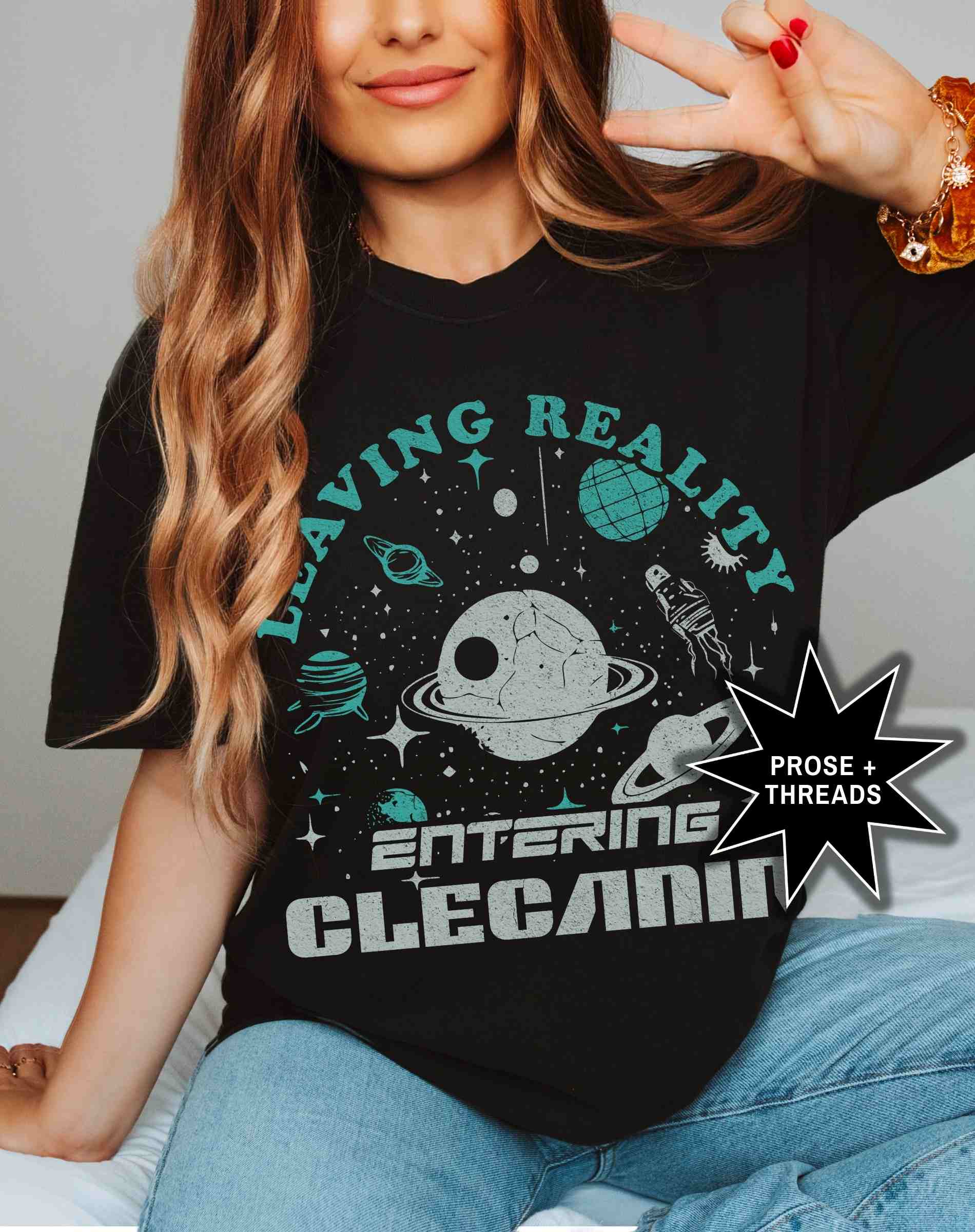 Woman wearing Entering Clecanian Shirt with celestial sci-fi graphic