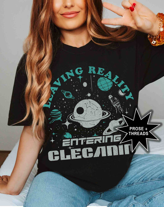 Woman wearing Entering Clecanian Shirt with celestial sci-fi graphic