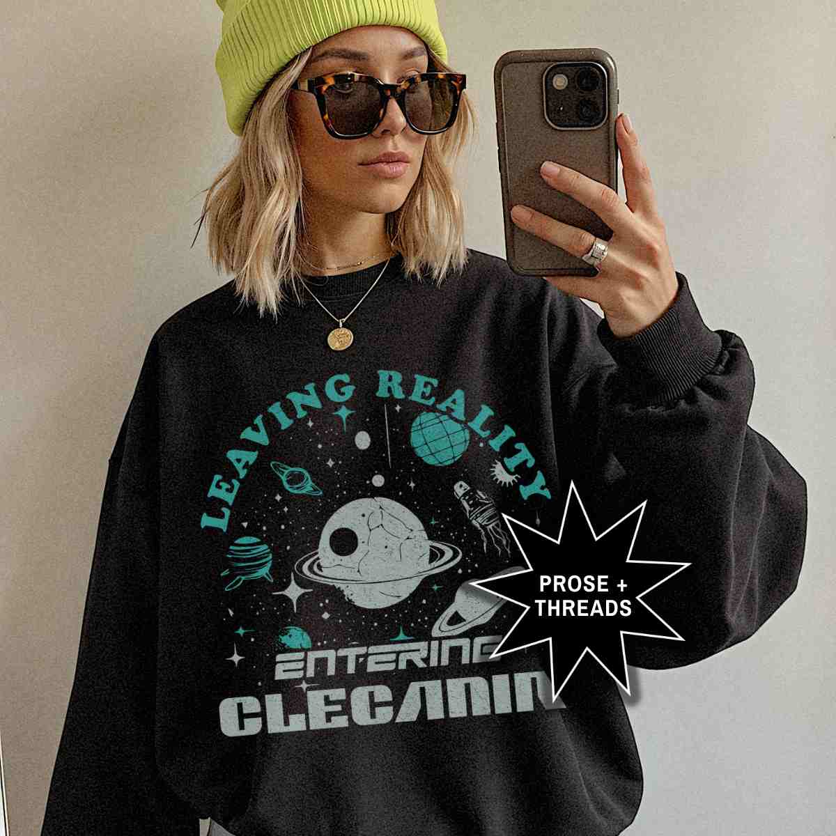 Woman wearing Entering Clecanian Sweatshirt with retro sci-fi graphic