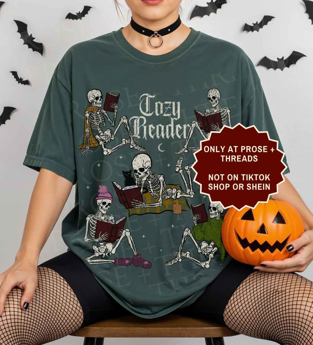 Cozy Reader Shirt featuring skeletons reading books in a vintage graphic design