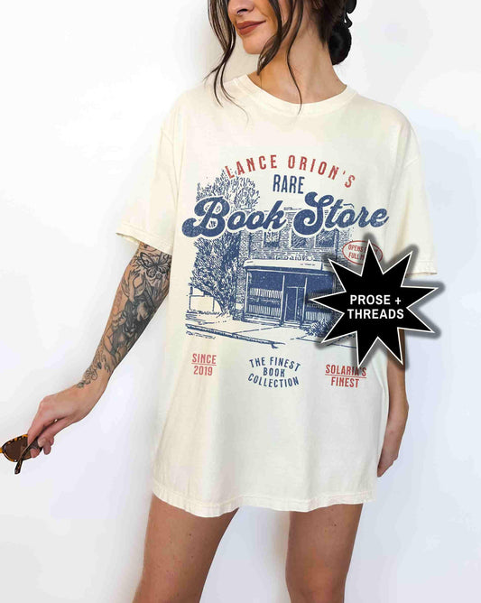 Woman wearing Lance Orion Bookshop Shirt with Zodiac Academy inspired graphic