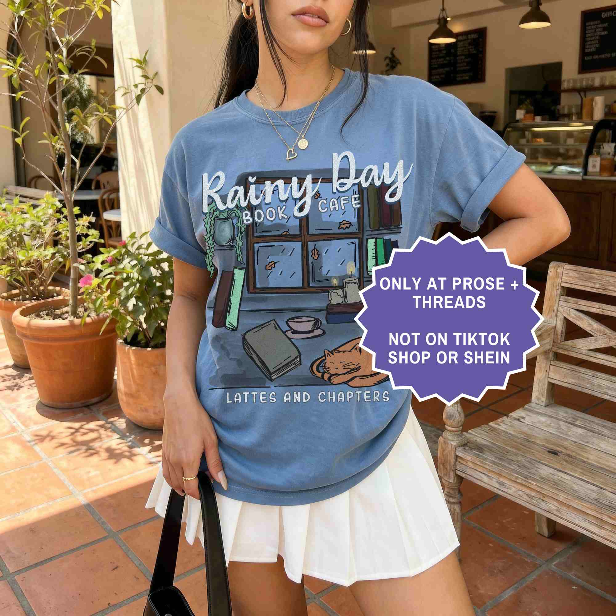Rainy day book café tee for cozy readers. A soft, aesthetic shirt for book lovers who enjoy quiet, rainy reading days.