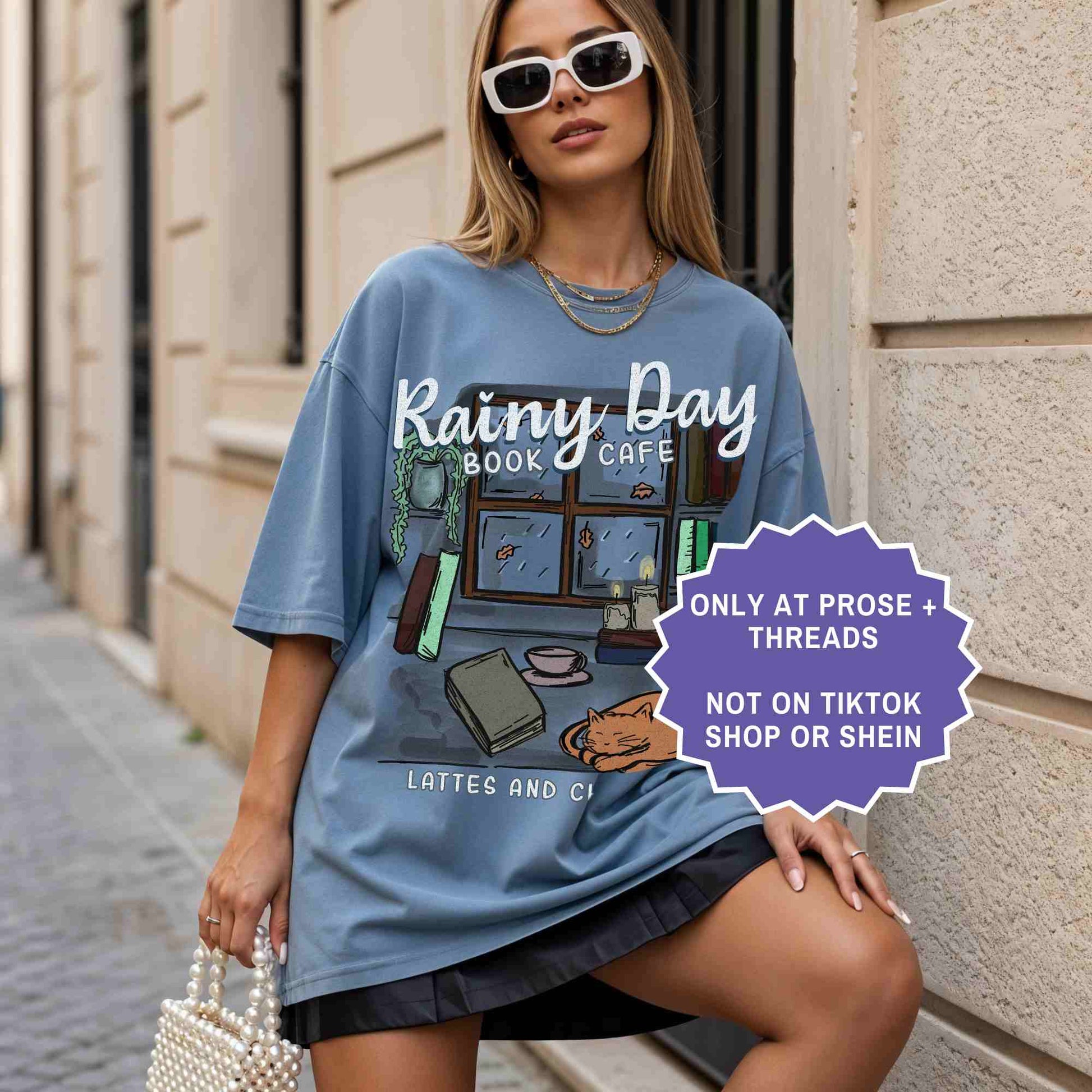 Rainy day book café tee for cozy readers. A soft, aesthetic shirt for book lovers who enjoy quiet, rainy reading days.