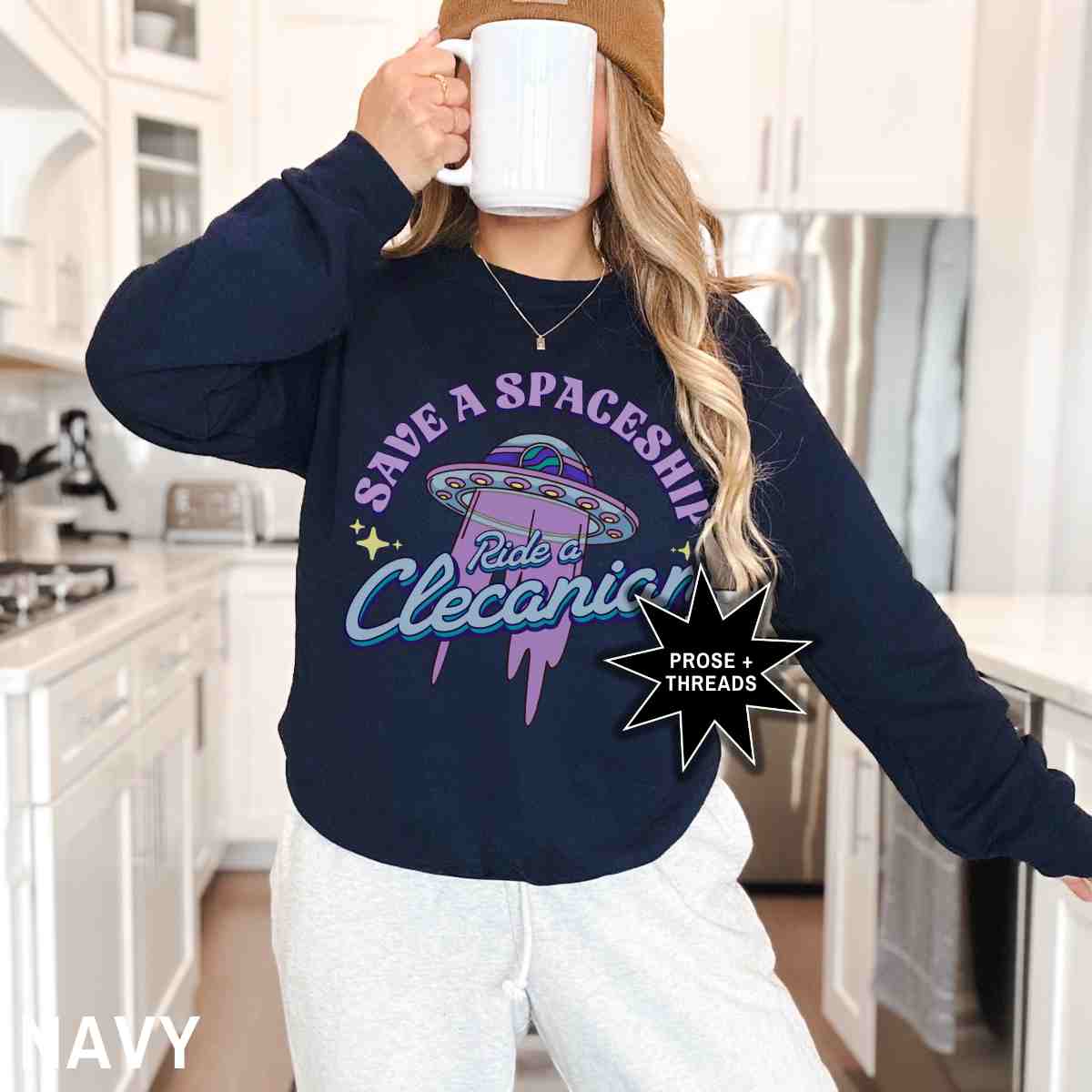 Woman wearing Ride A Clecanian Sweatshirt with retro sci-fi graphic
