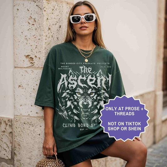 Woman wearing The Ascent Dire Bound dark romantasy shirt with dire wolf graphic